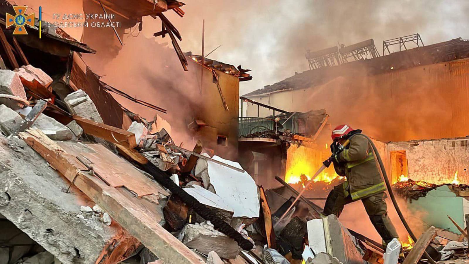 A firefighter works to contain the aftermath of a Russian attack in Zatoka