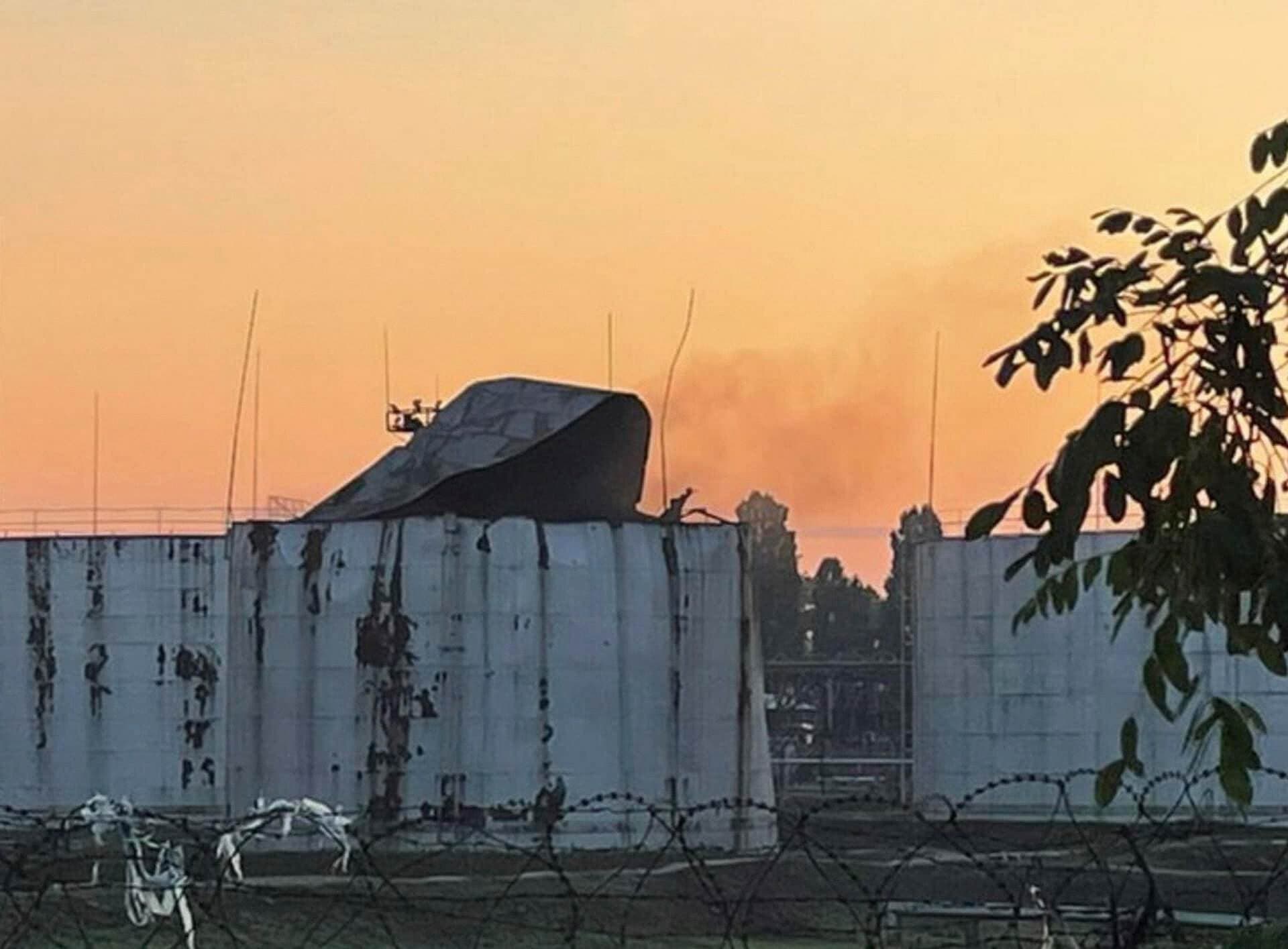 Storage tanks damaged by a Russian drone strike are seen in a sea port in Odesa Region