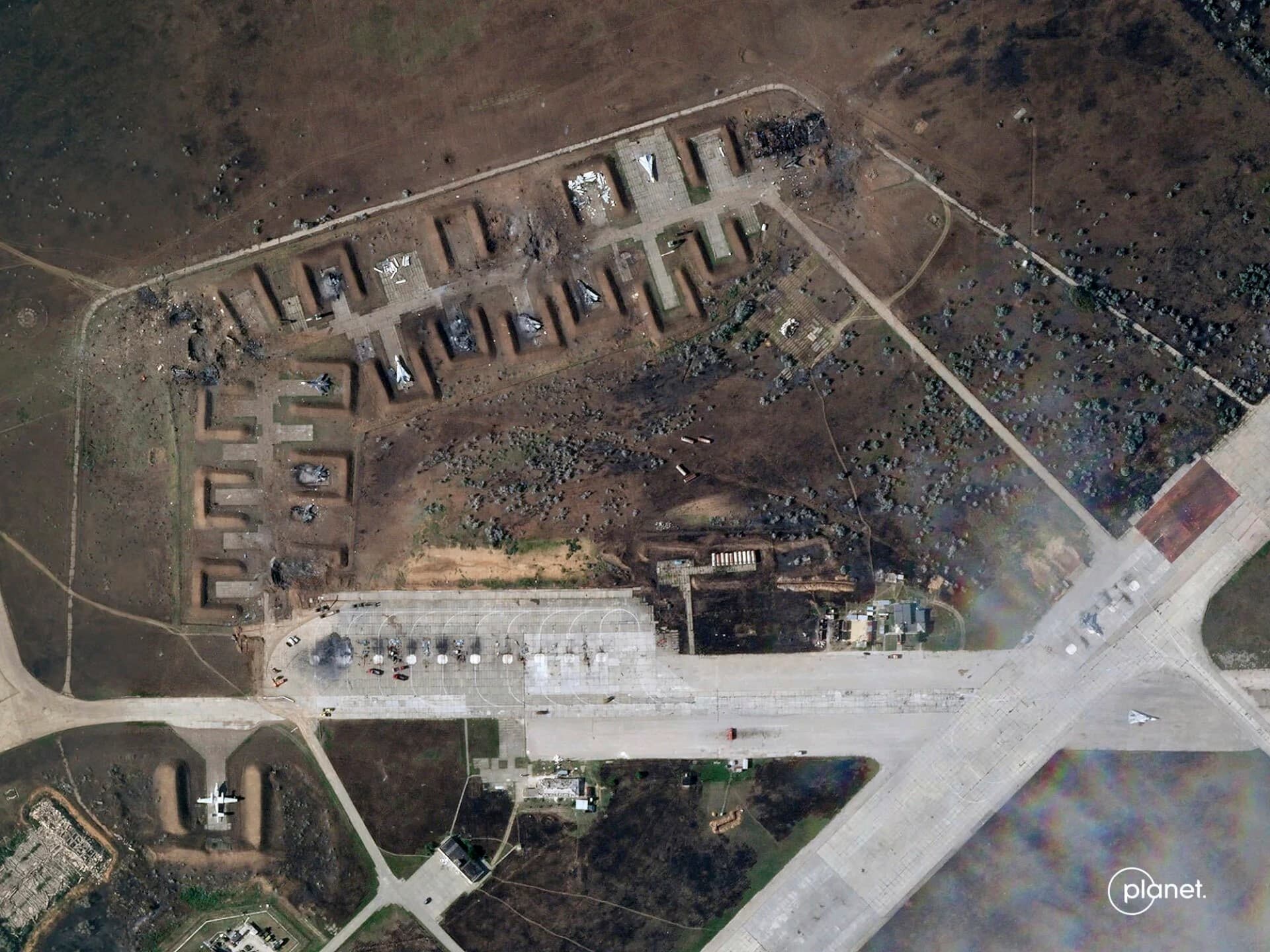 This satellite image provided by Planet Labs PBC shows destroyed Russian aircraft at Saki Air Base after an explosion Tuesday, Aug. 9, 2022, in the Crimean Peninsula