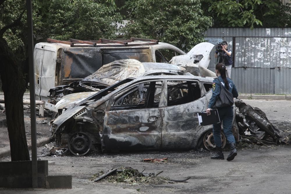 scene of burned vehicles after the shelling in the Petrovsky district of Donetsk