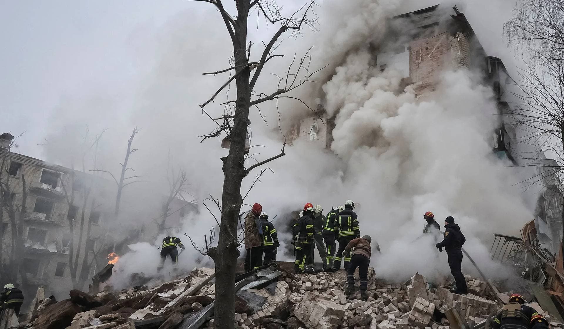 Rescuers work at a site of a residential building heavily damaged during a Russian missile attack in Kharkiv