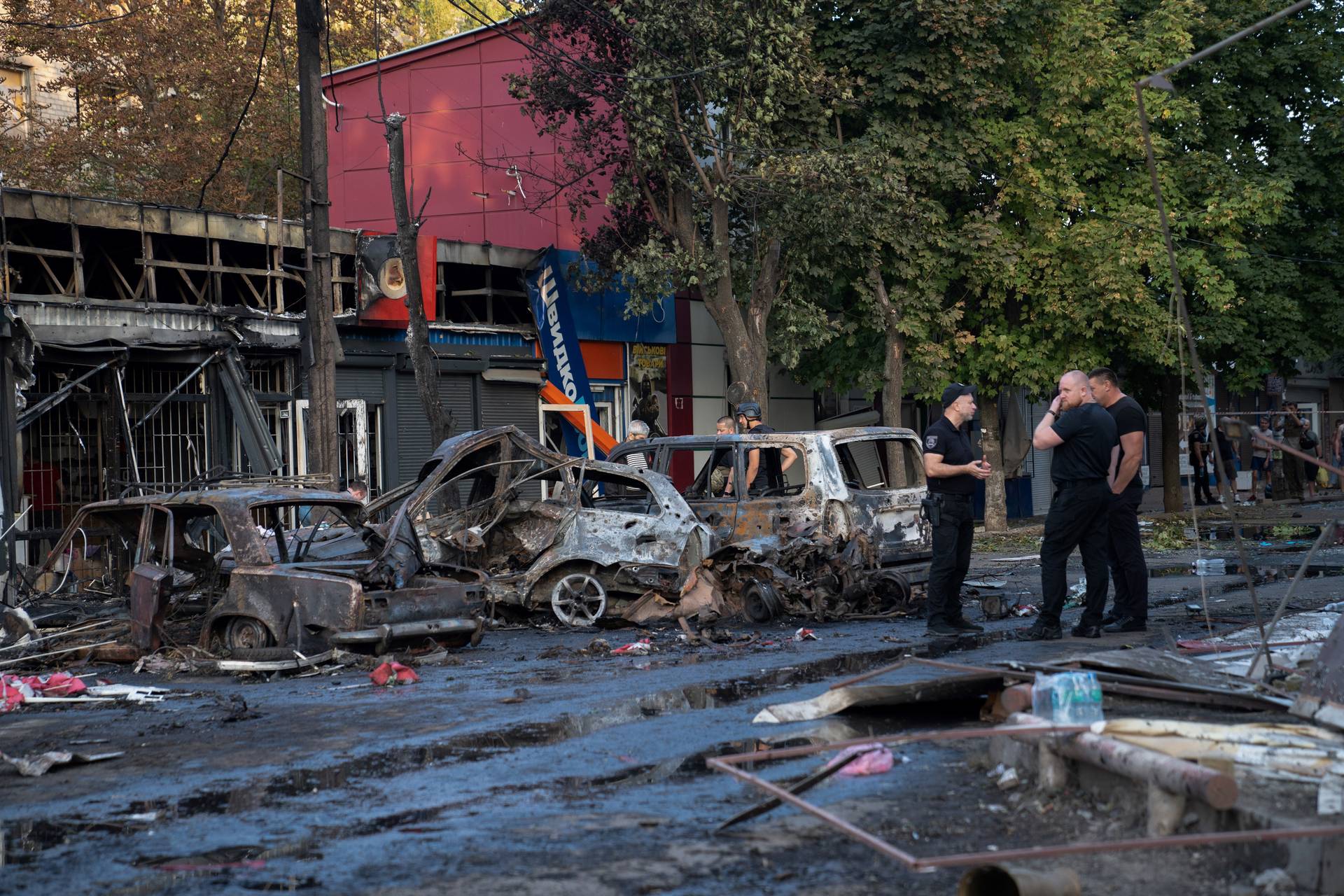 Burnt cars at the site at of a Russian strike at a market in Kostyantynivka