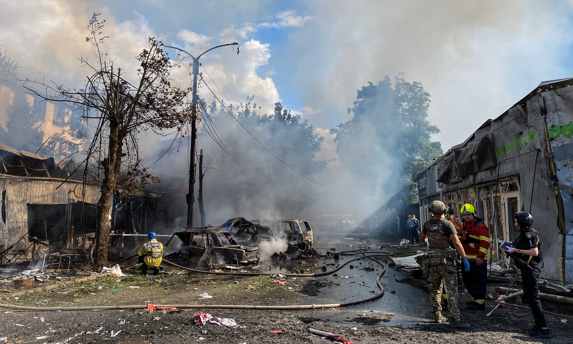Firefighters extinguish the fire caused by a Russian rocket at a market Kostiantynivka