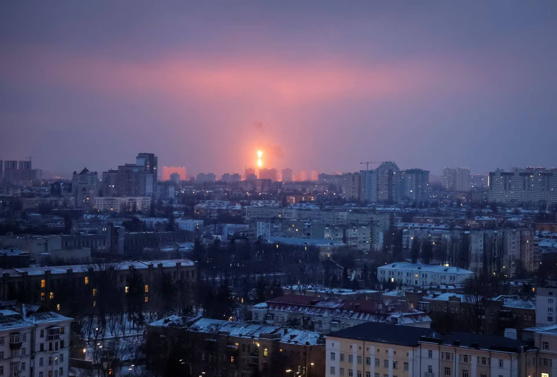 An explosion of a missile is seen in the sky over the city during a Russian missile strike in Kyiv