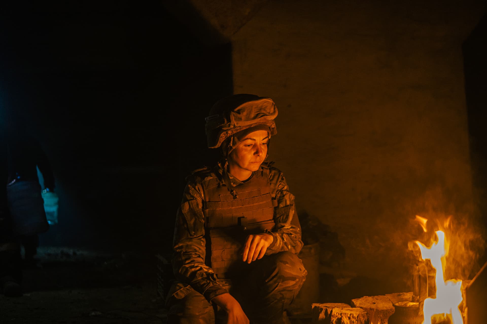 A Ukrainian woman soldier inside the ruined Azovstal steel plant take a rest in his shelter in Mariupol
