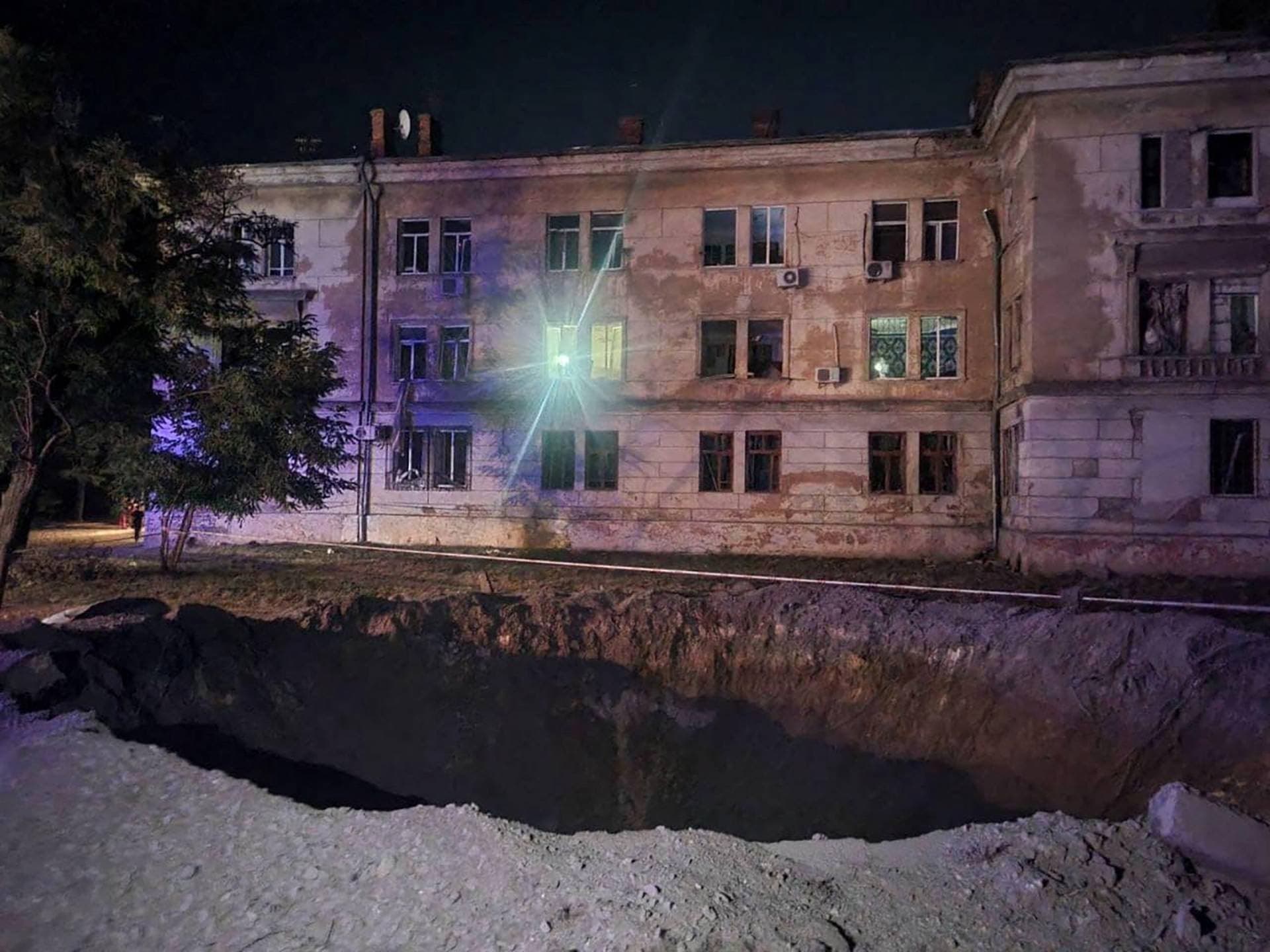 A crater made during Russian missile and drone strikes is seen in Odesa