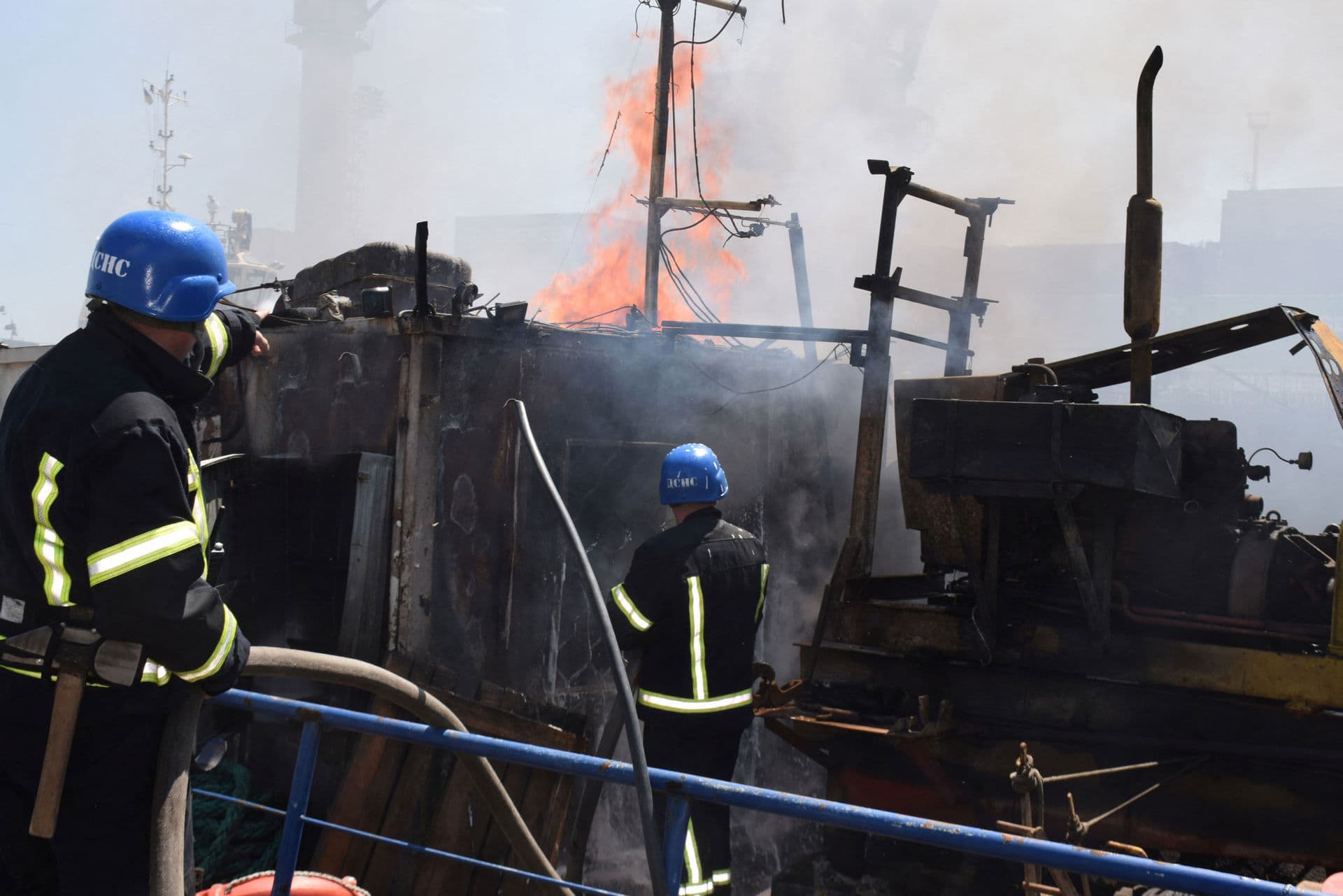 Firefighters work at a site of a Russian missile strike in the sea port of Odesa