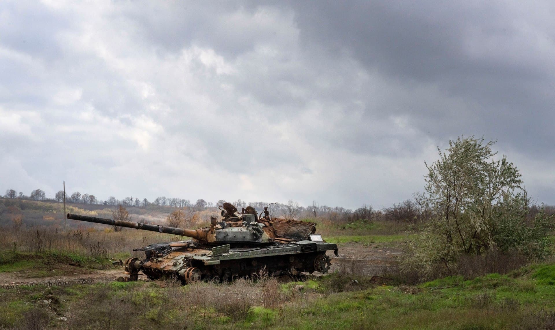 A Russian tank damaged in recent fighting is seen in the field near the recently retaken village of Kamianka