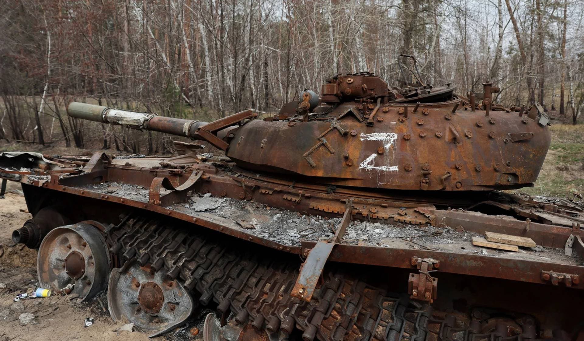 A destroyed Russian tank remains on the side of the road near the frontline town of Kreminna