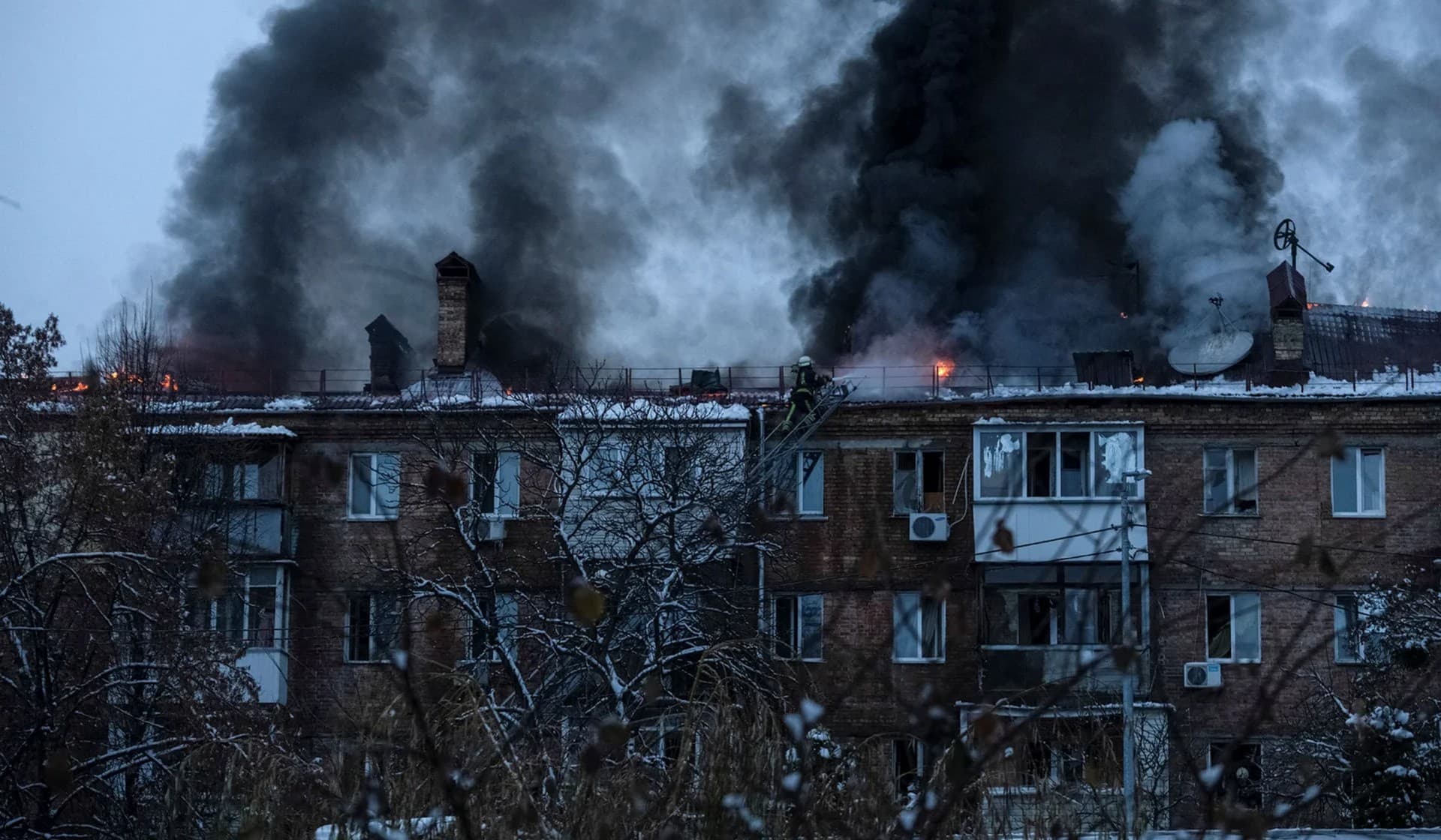 Rescuers work at a site of a residential building destroyed by a Russian missile attack in Vyshhorod