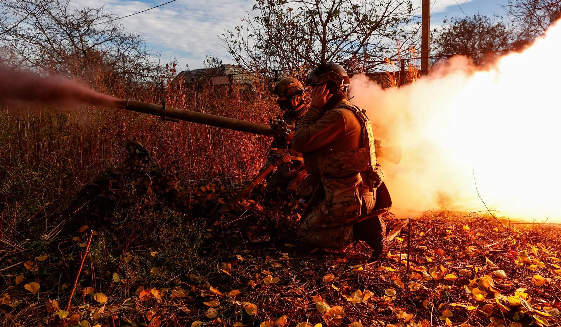 Members of Ukraine's National Guard Omega Special Purpose fire an SPG-9 anti-tank grenade launcher toward Russian troops in Avdiivka