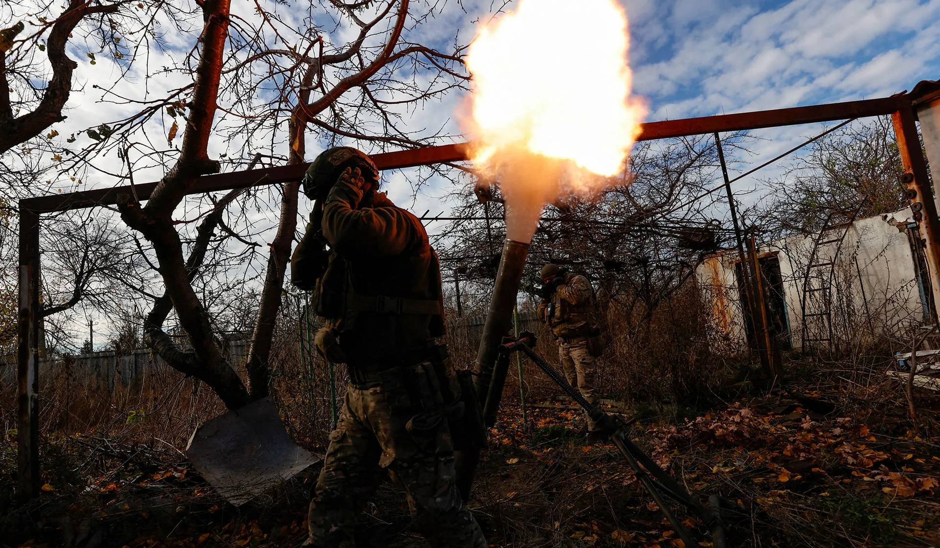 Members of Ukraine's National Guard Omega Special Purpose unit fire a mortar toward Russian troops in Avdiivka