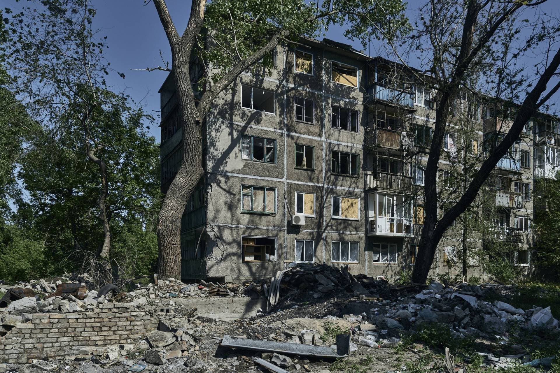 An abandoned apartment building damaged in the Russian shelling is seen in Chasiv Yar