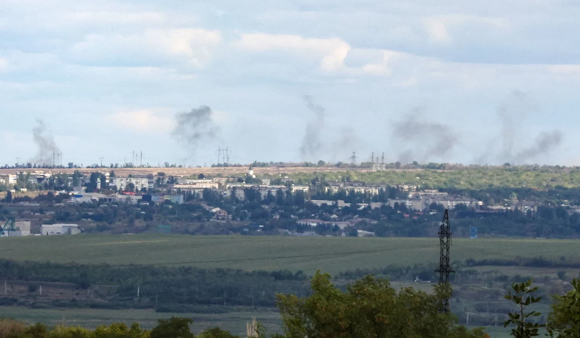 Smoke rises in the distance following recent Russian shelling near Bakhmut