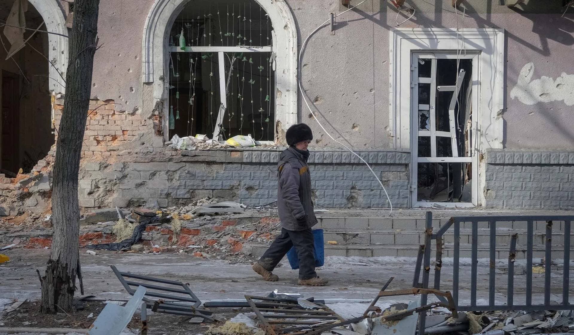 A local resident walks an empty street in the front line city of Bakhmut