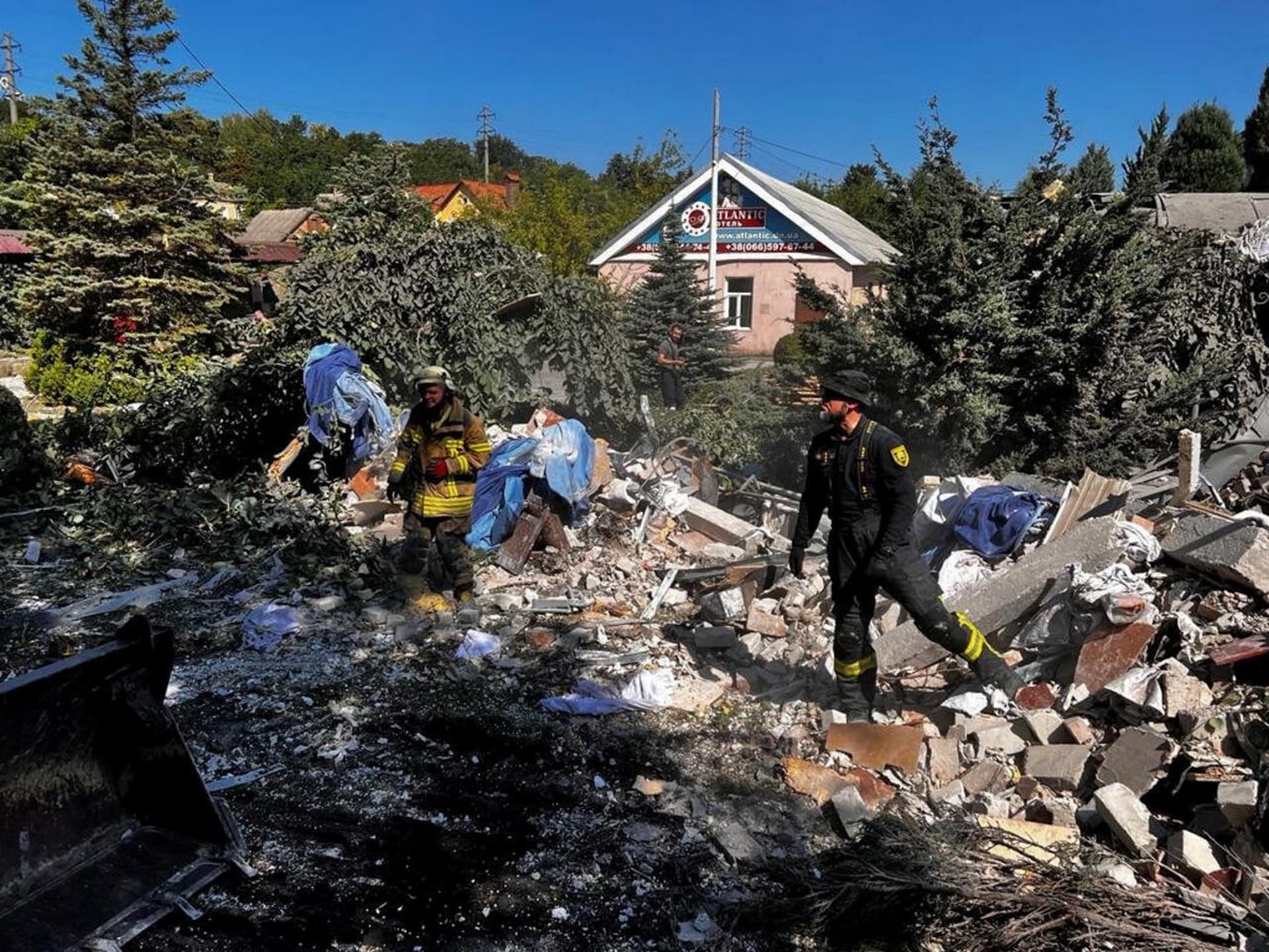 Rescuers remove debris of a hotel destroyed by a Russian military strike, as Russia's attack on Ukraine continues, in the town of Bakhmut