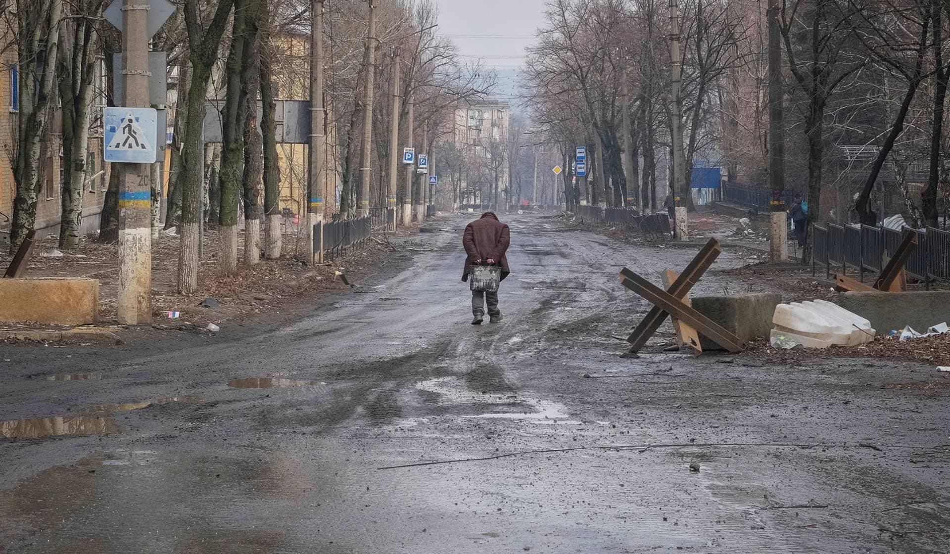 A local resident walks along an empty street in the frontline city of Bakhmut
