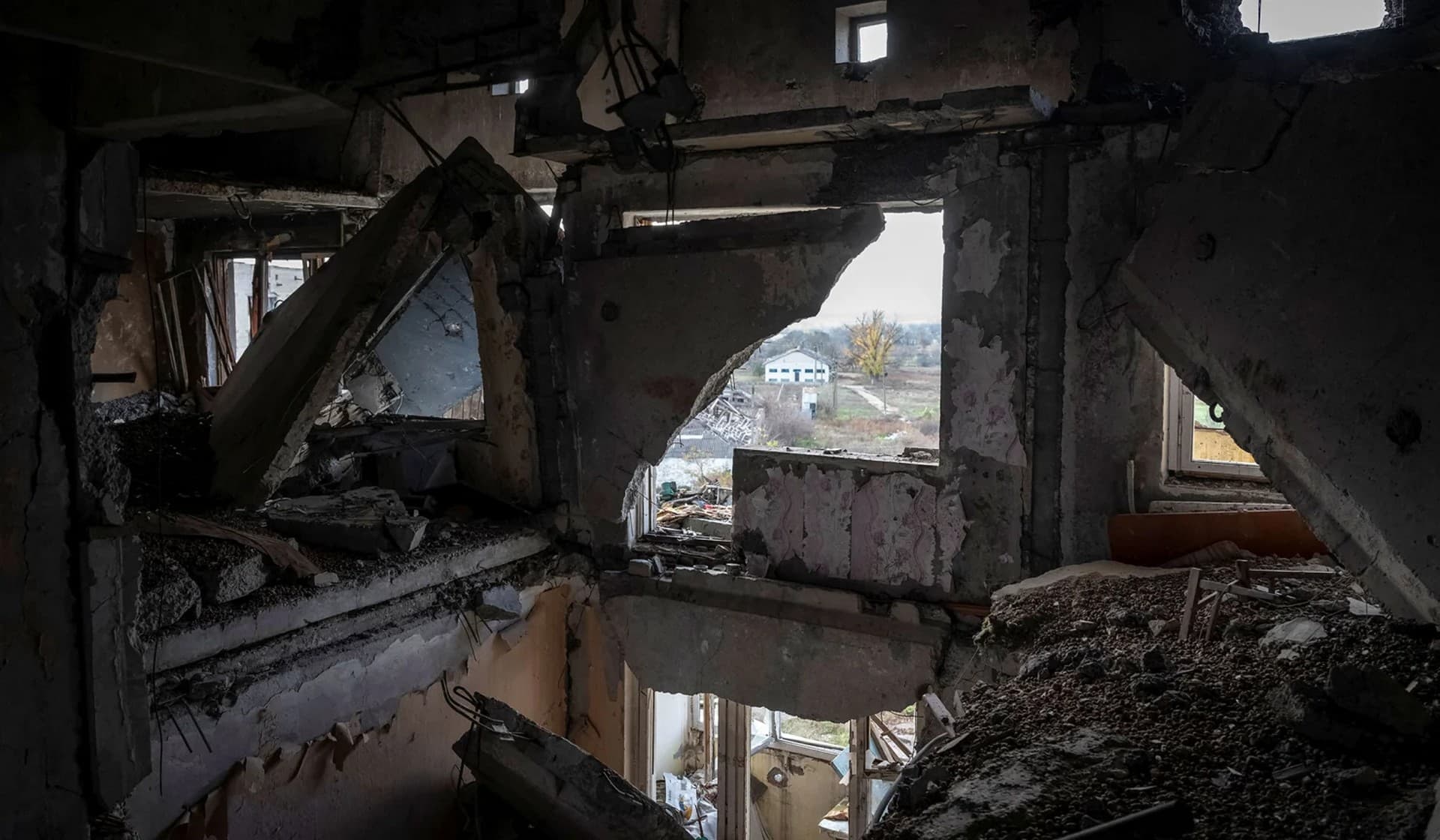 Inside a destroyed apartment building in the village of Arkhanhelske