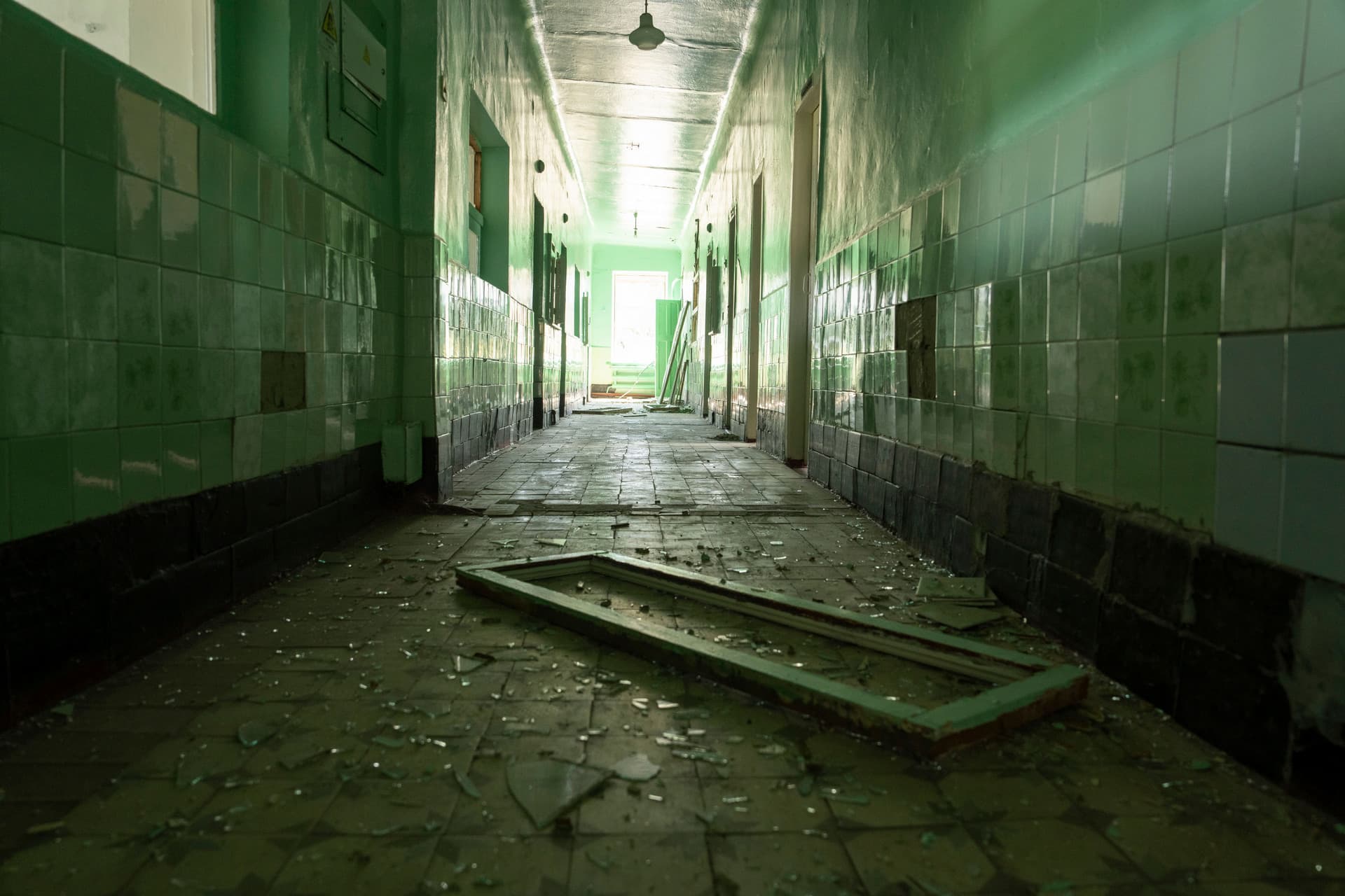 Debris and broken glass is scattered on the floor of the damaged infectious illness department after a Russia attack at the hospital in Zolochiv