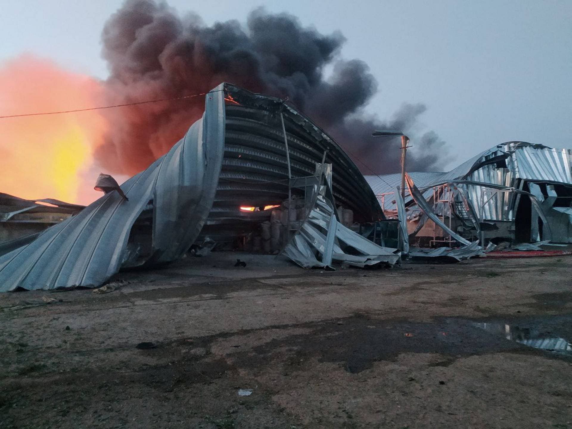 A grain warehouse destroyed by a Russian missile strike at a compound of an agricultural company in Odesa region