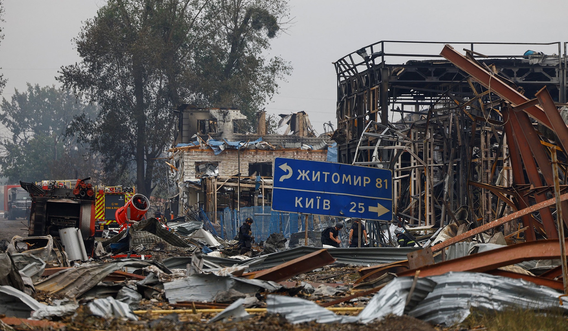 Rescuers work at the site of Friday evening's Russian drone strikes in Myla, Kyiv Region