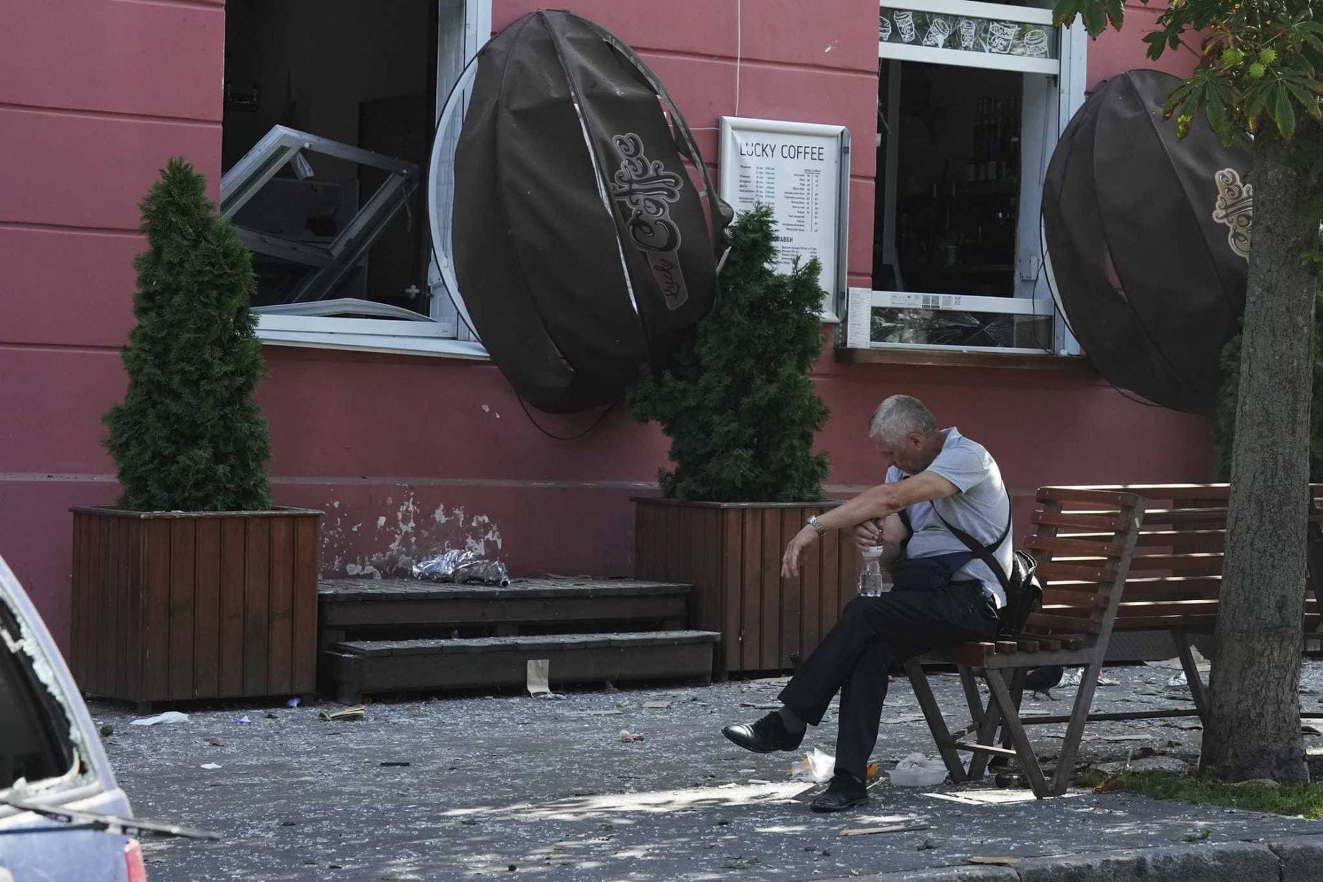 A man reacts next to a restaurant damaged by a Russian attack in Chernihiv
