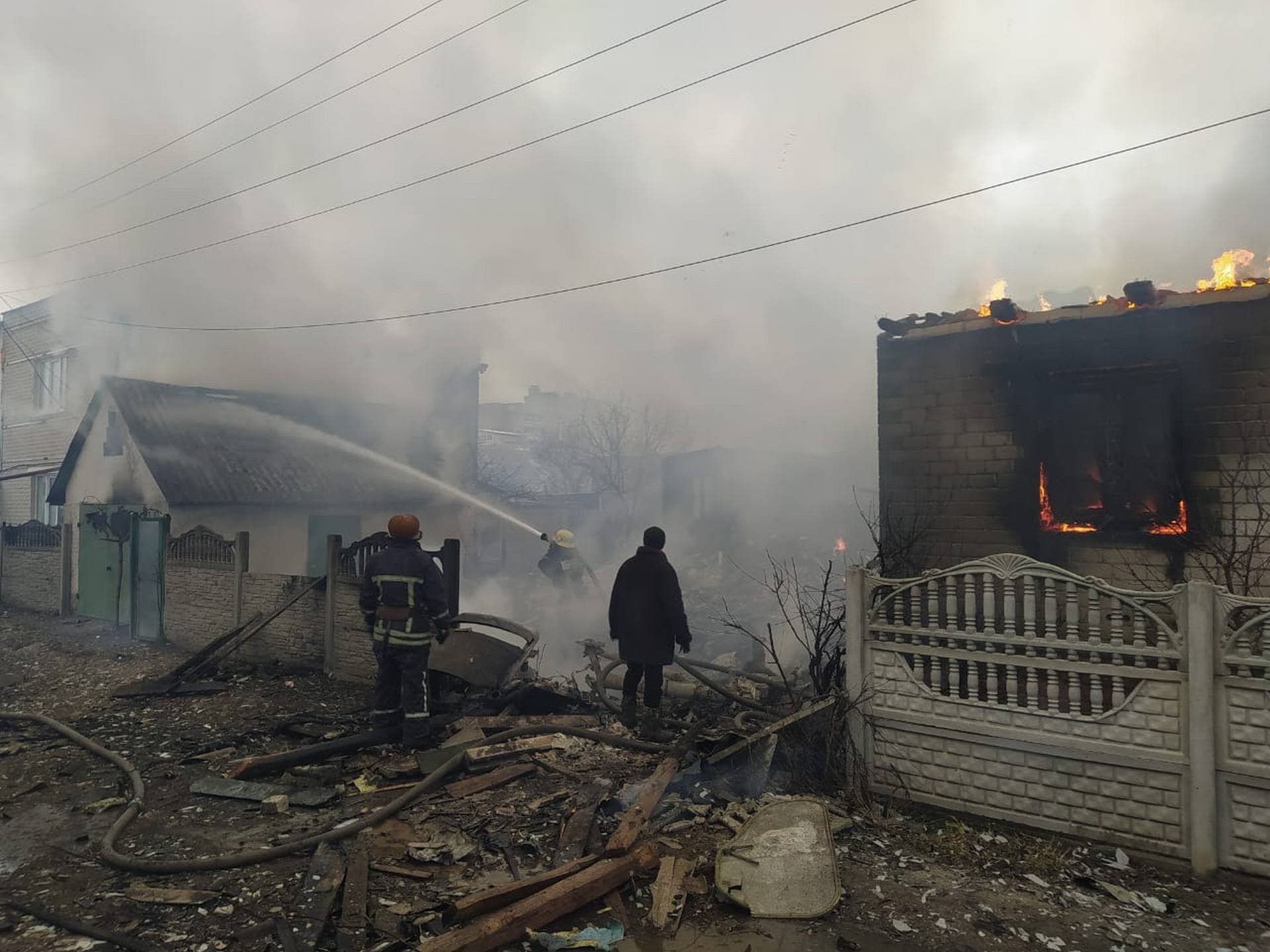 Firefighters try to extinguish a fire after a Russian attack in Chernihiv