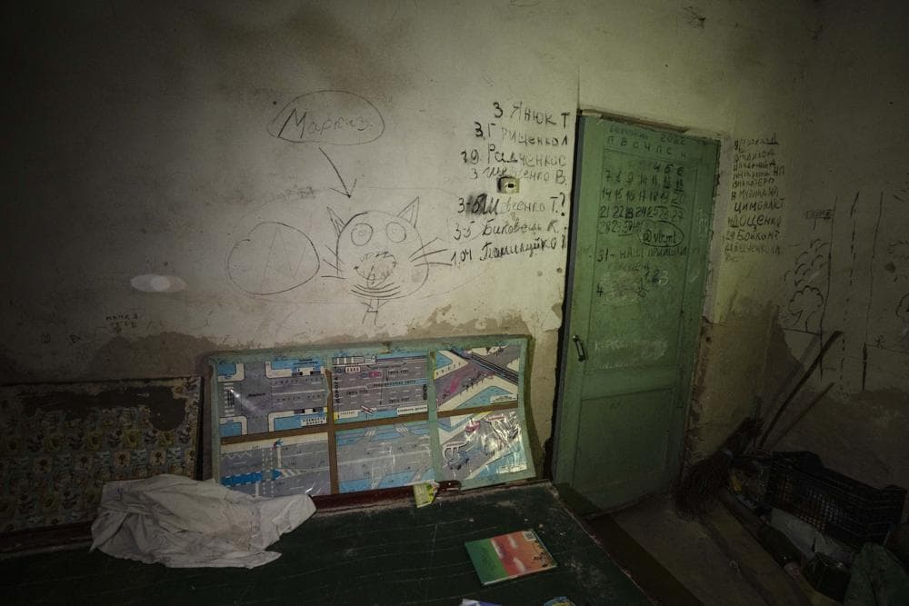 Markings are shown made by children and adults in the basement of a school which was used as a bomb shelter for children and their parents, as their village was being attacked by Russian strikes, in Yahidne village, northern Chernihiv region