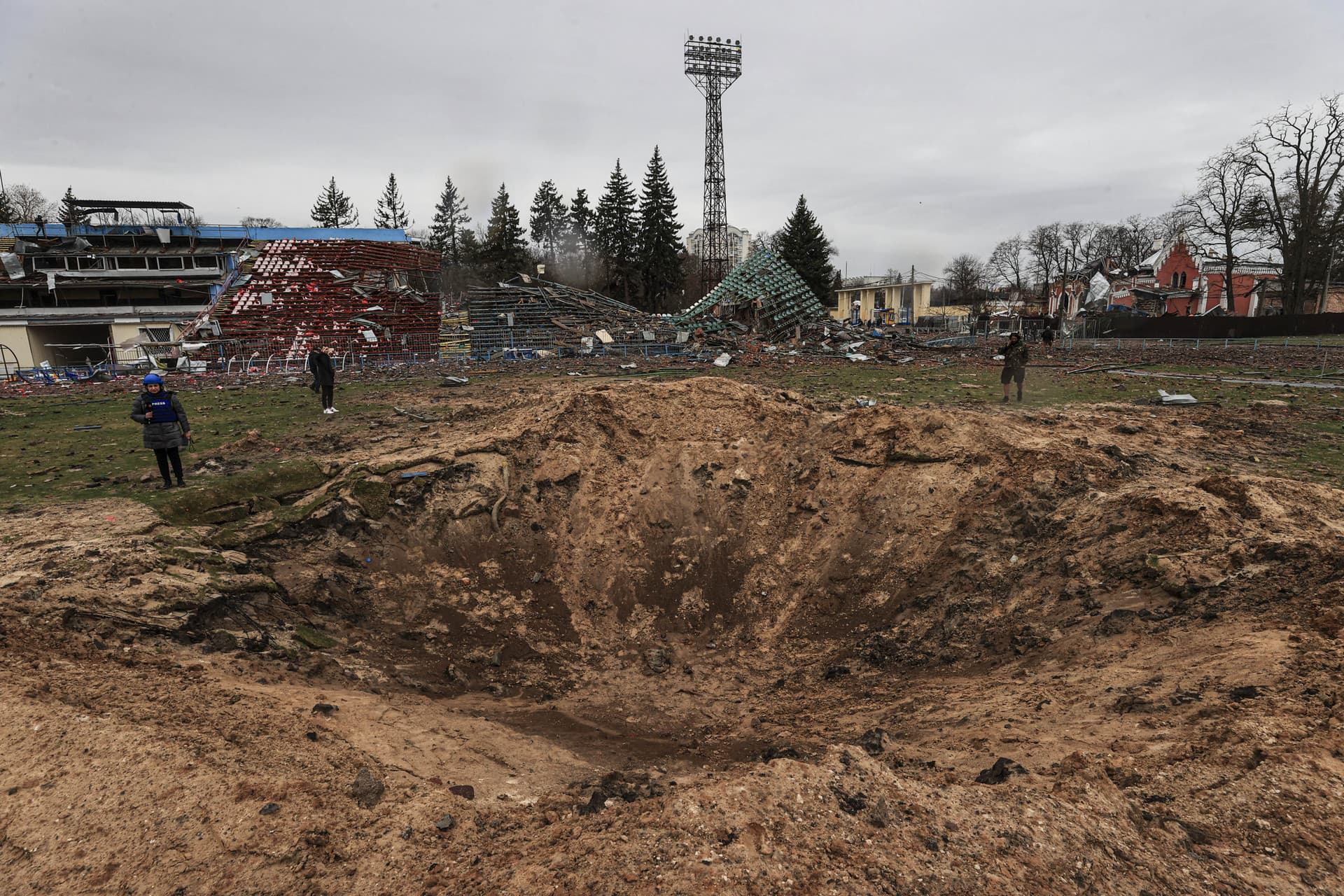 A huge crater from Russian shelling at the former Yuri Gagarin stadium