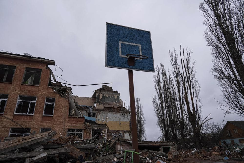 A basketball hoop and backboard stands amid the damage at a school after an airstrike by Russian forces in Chernihiv