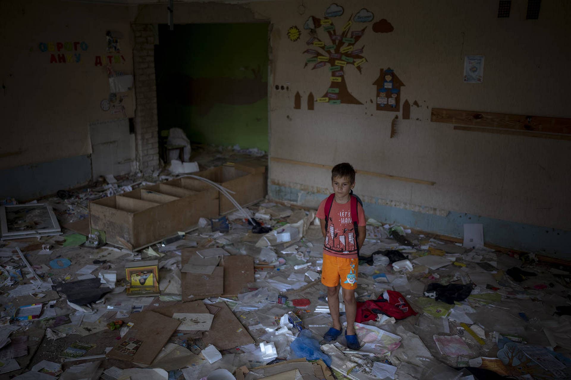 Ivan Hubenko stands in the remains of his classroom in the Chernihiv School #21, which was bombed by Russian forces on March 3, in Chernihiv