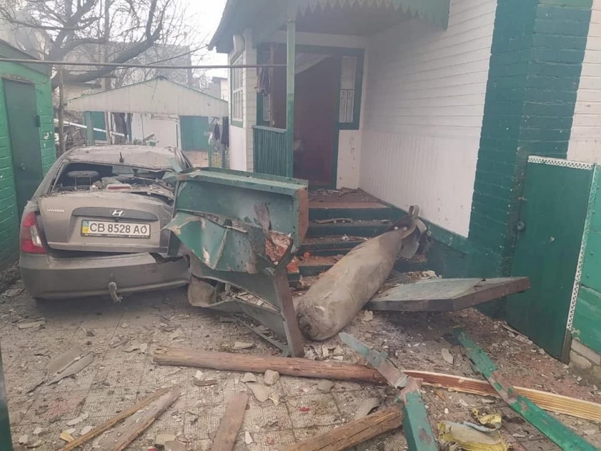 A non exploded Russian aviation bomb FAB-500 is seen next to a home in Chernihiv