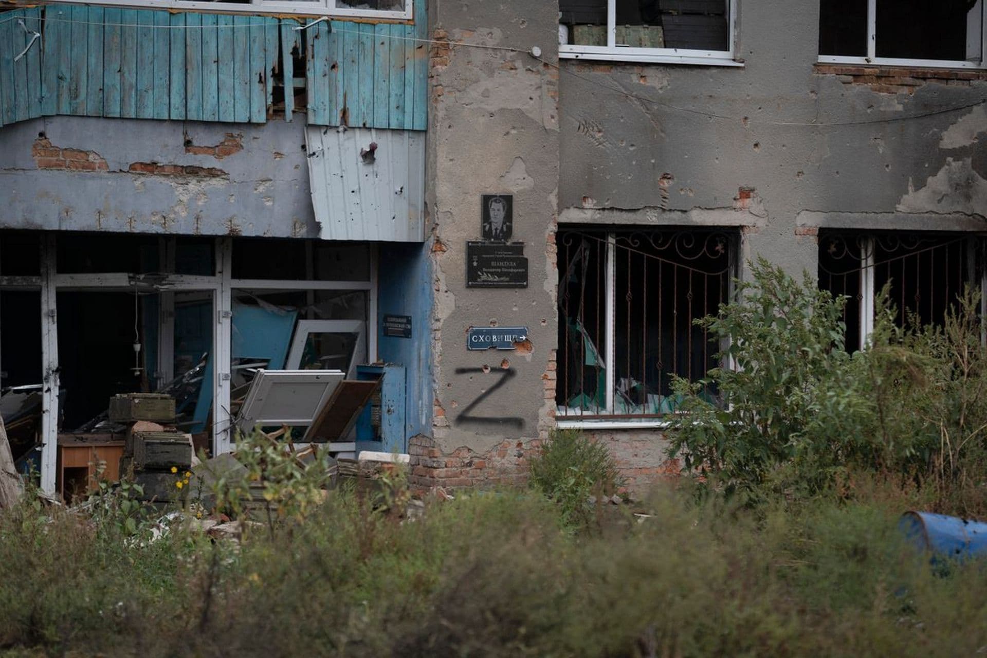 The letter Z is seen on a damaged building that was occupied by Russian soldiers in the freed village of Hrakove