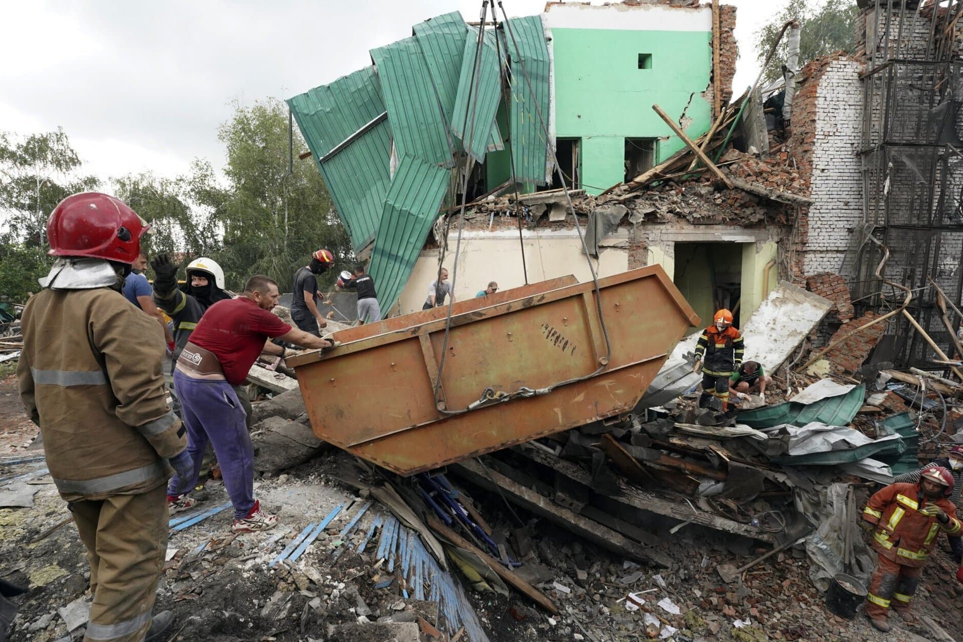 Rescuers remove debris after a Russian missile attack on Monday in Chuhuiv