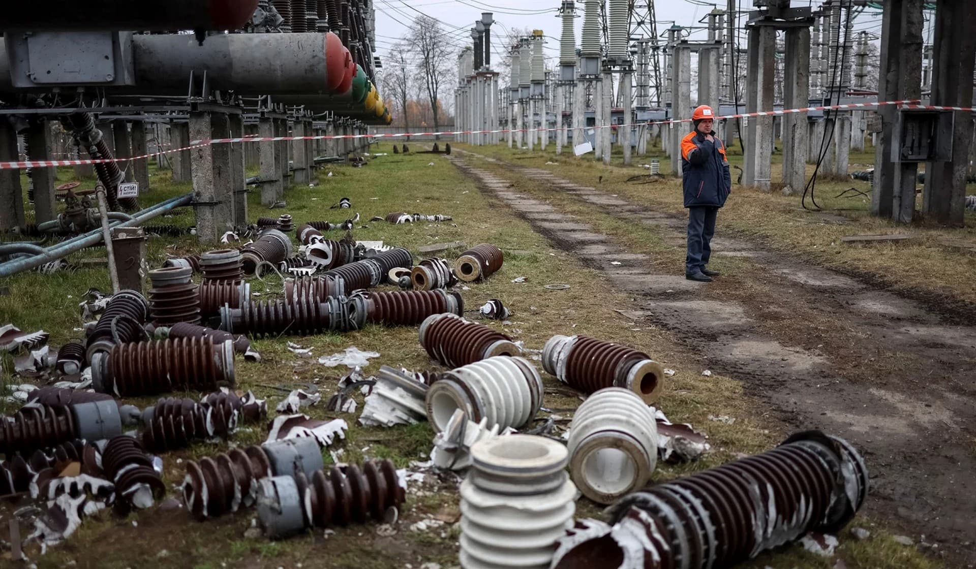 A worker at a high-voltage substation of Ukrenergo damaged in a Russian military strike in the central region of Ukraine, November 10, 2022.