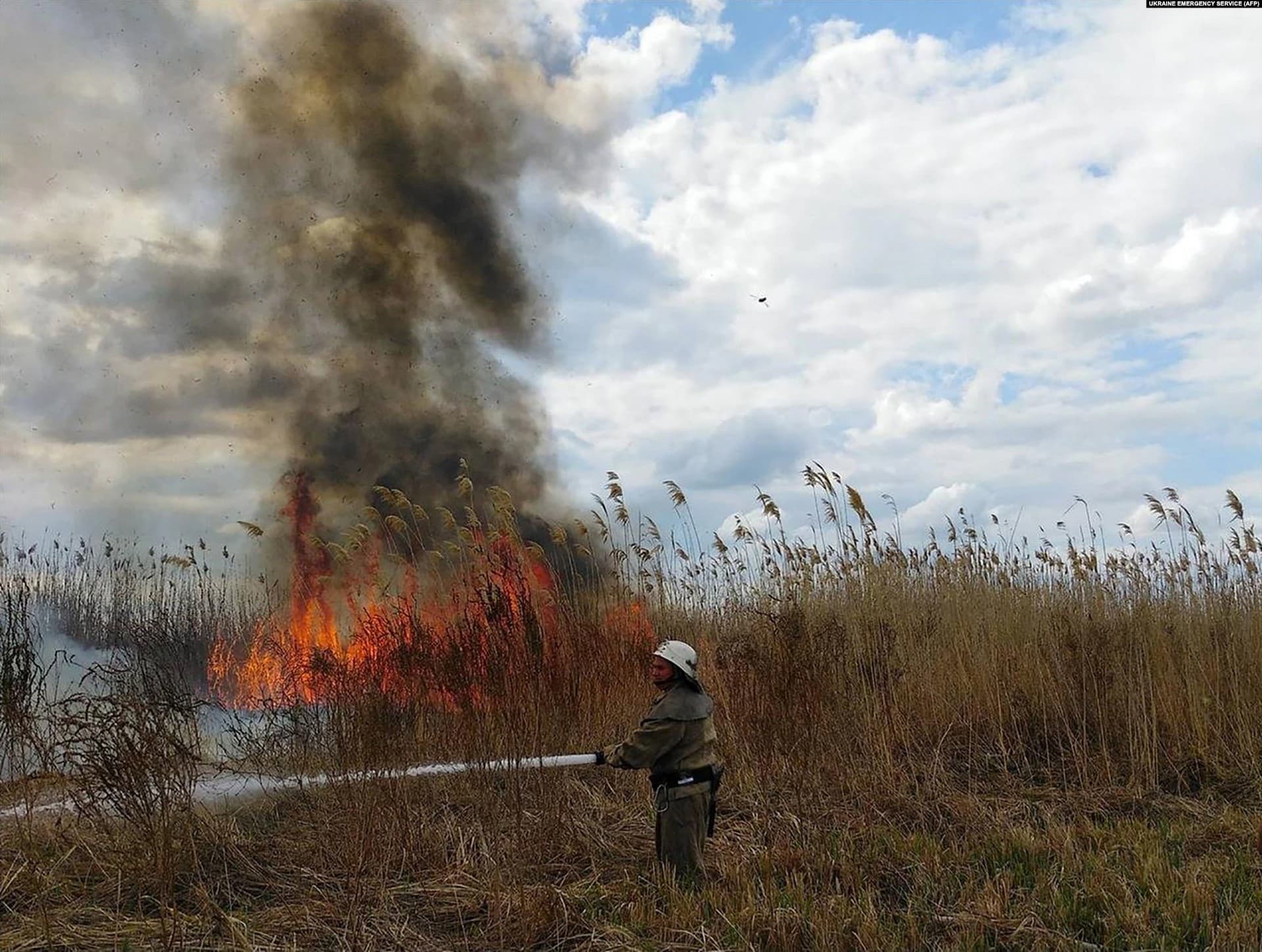 A firefighter battles a blaze in the Kherson region on July 18