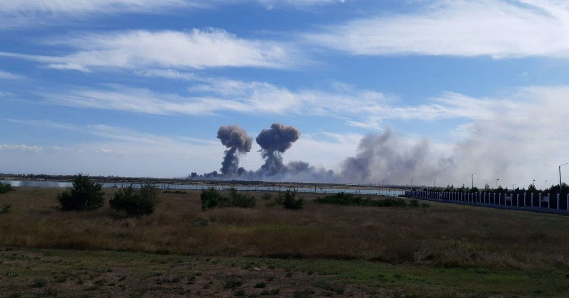 Smoke rises after explosions were heard from the direction of a Russian military airbase near Novofedorivka, Crimea