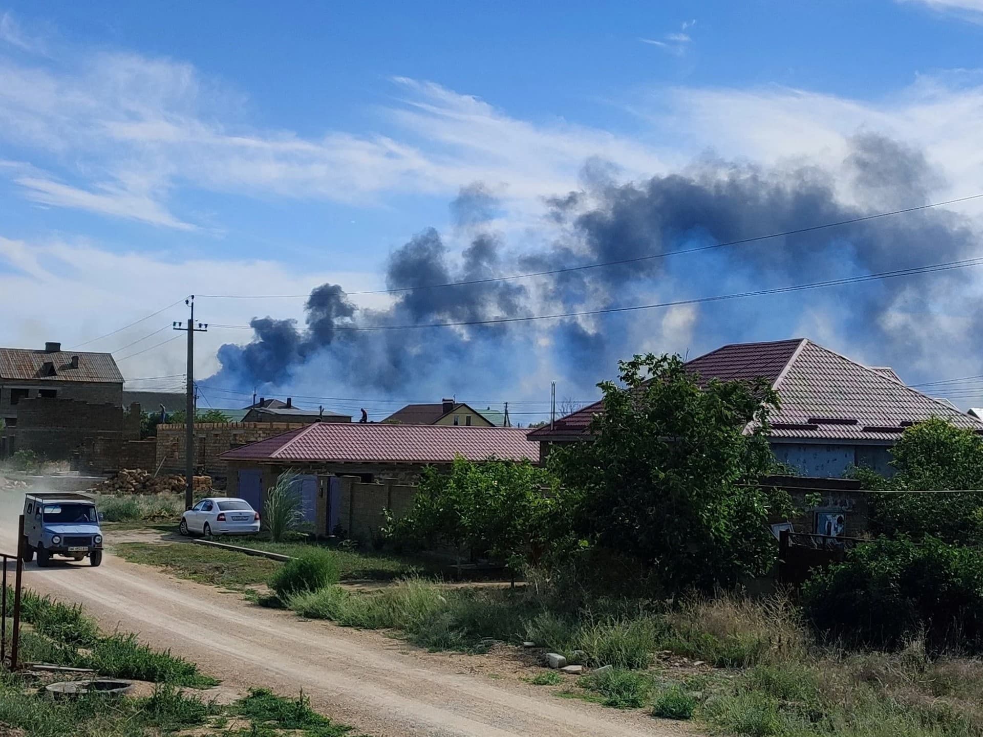 Smoke rises after explosions were heard from the direction of a Russian military airbase in annexed Crimea