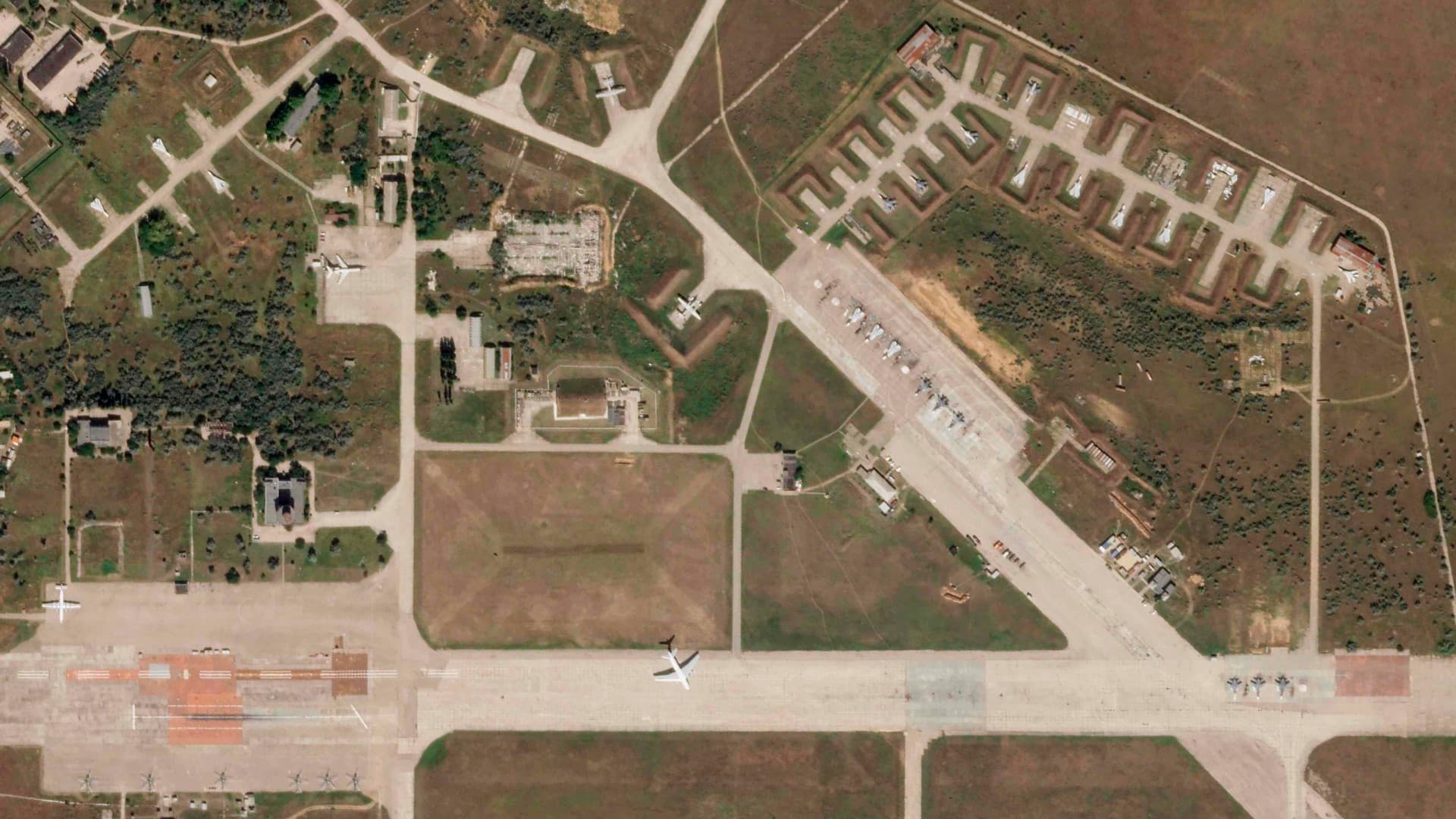 A satellite image by Planet Labs PBC shows aircraft at Saki Air Base before an explosion Tuesday, Aug. 9, 2022, in the Crimean Peninsula