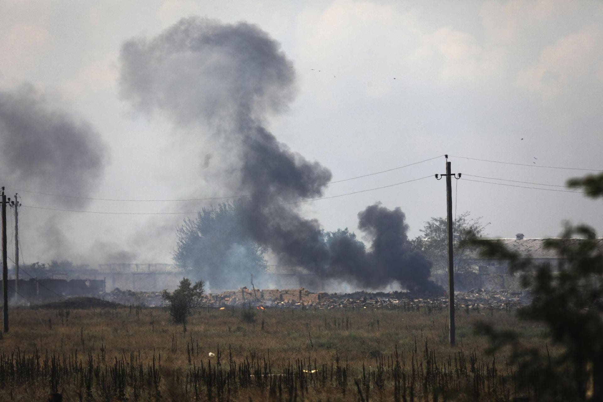 Smoke rises over the site of explosion at an ammunition storage of Russian army near the village of Mayskoye, Crimea