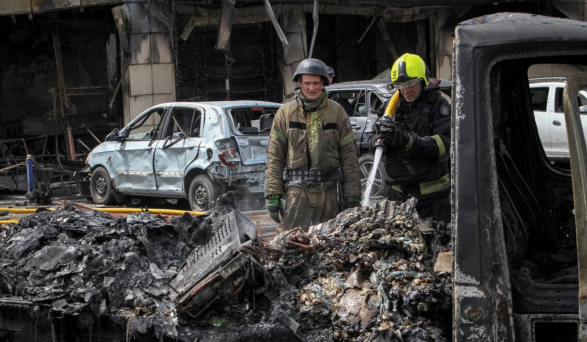 Rescuers works at the site a Russian drone strike in Dnipro