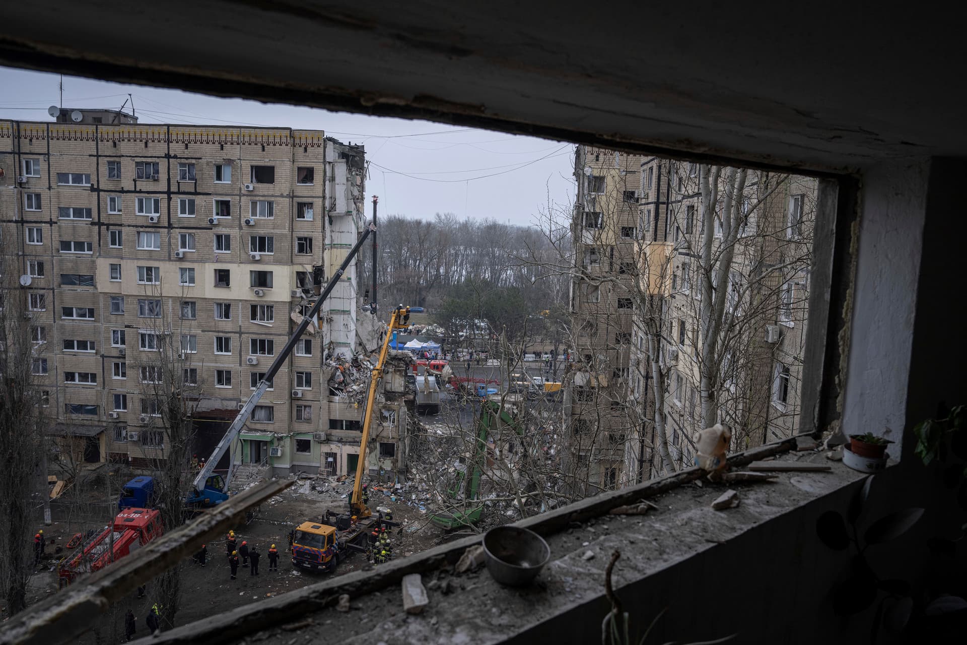 Rescue workers clear the rubble from an apartment building that was destroyed in a Russian rocket attack at a residential neighbourhood in the southeastern city of Dnipro