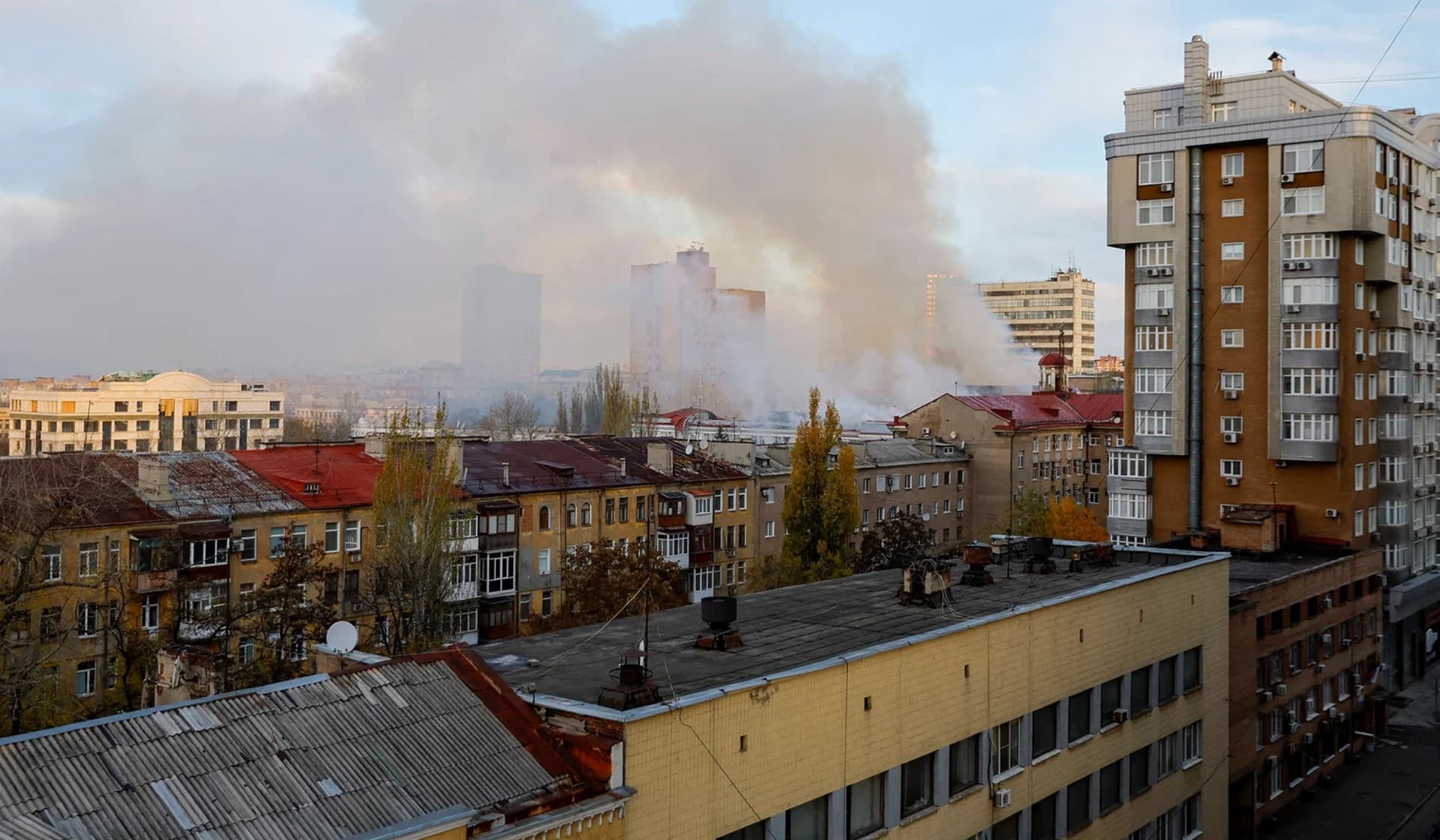 Smoke rises near a local railway administration headquarters damaged in shelling in Donetsk