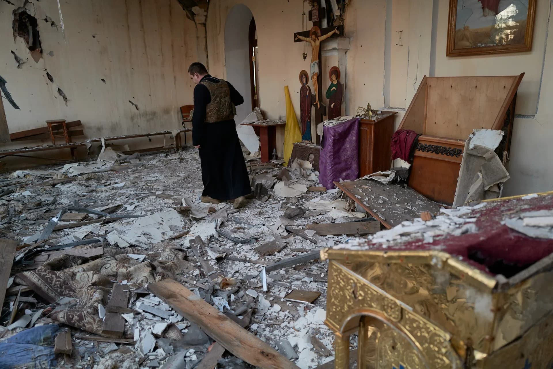 Ukrainian military chaplain visits a bombed church on the frontline near Donetsk