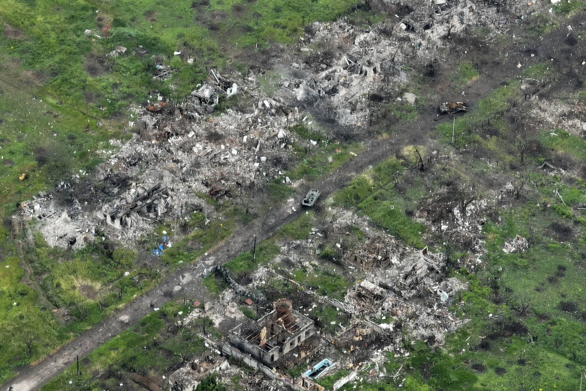 An aerial view of damaged private houses and shell and rocket craters in the suburbs of Donetsk