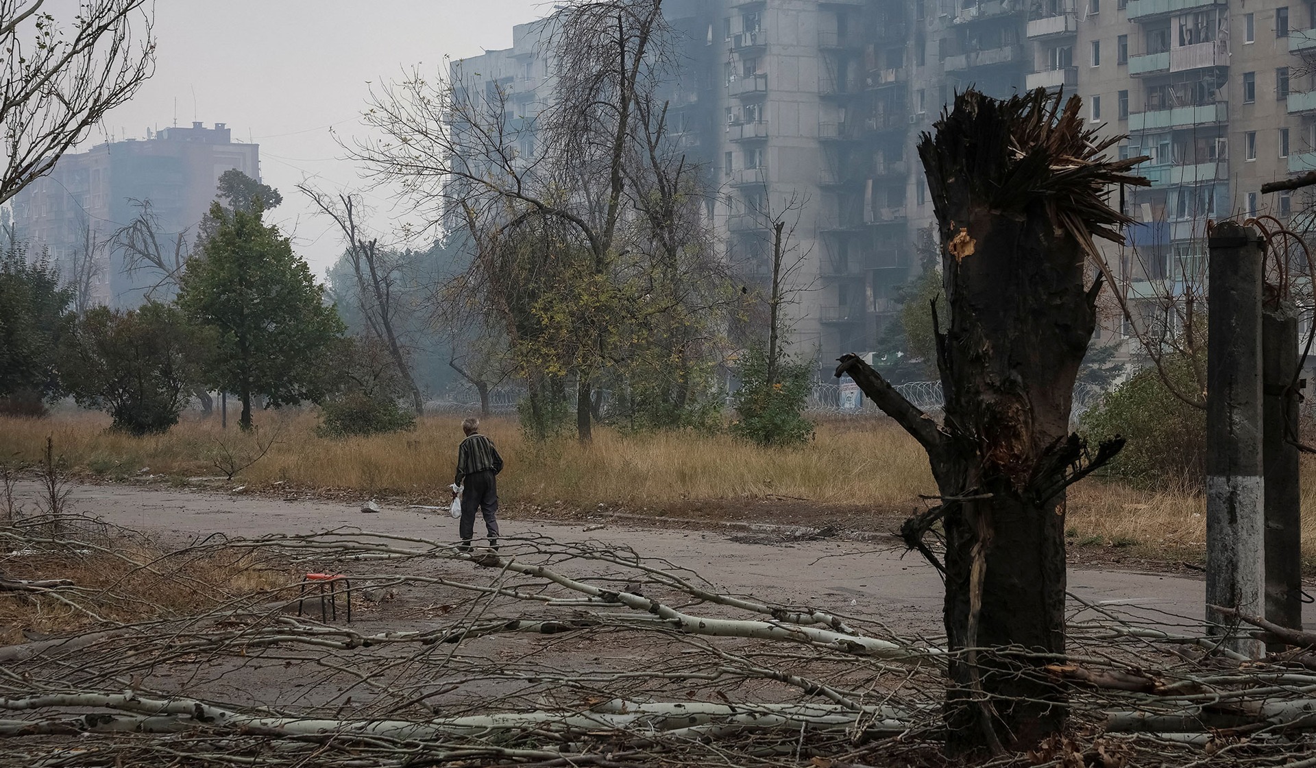 A resident walks on a street in the frontline town of Druzhkivka