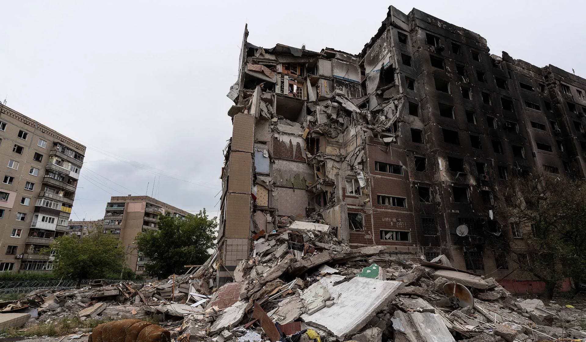 Destroyed apartment buildings in the frontline town of Druzhkivka