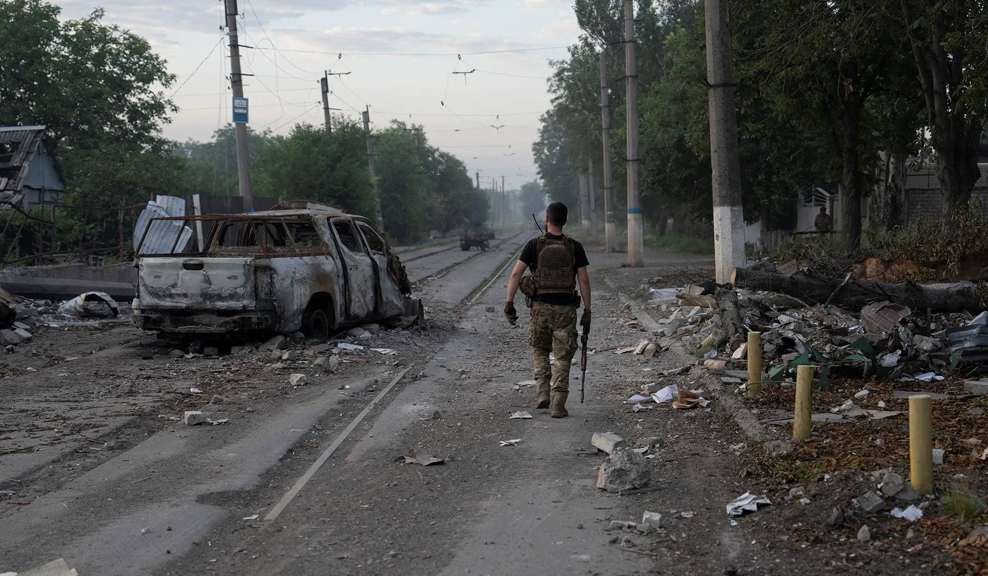 A serviceman of the Ukrainian Armed Forces walks along a street in the frontline city of Druzhkivka