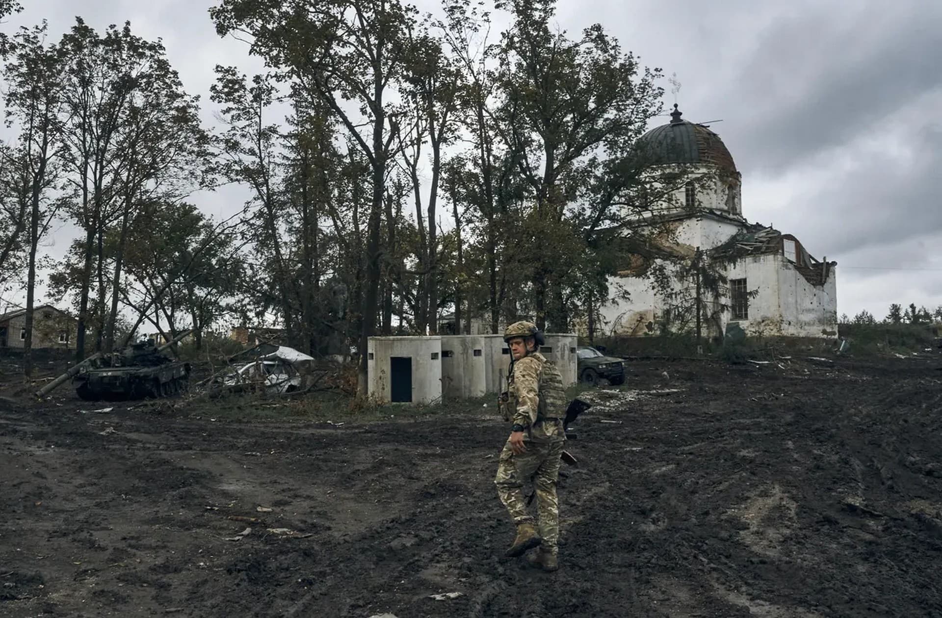 A Ukrainian soldier walks in Izium