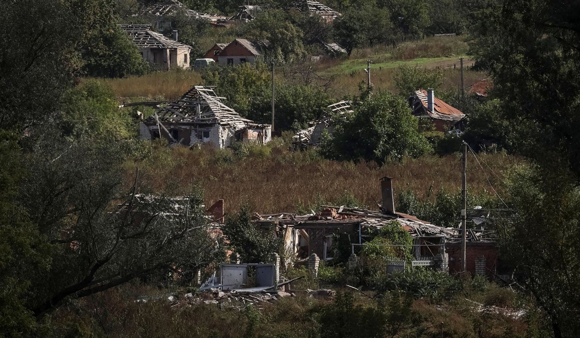 Destroyed buildings in the village of Kamyanka
